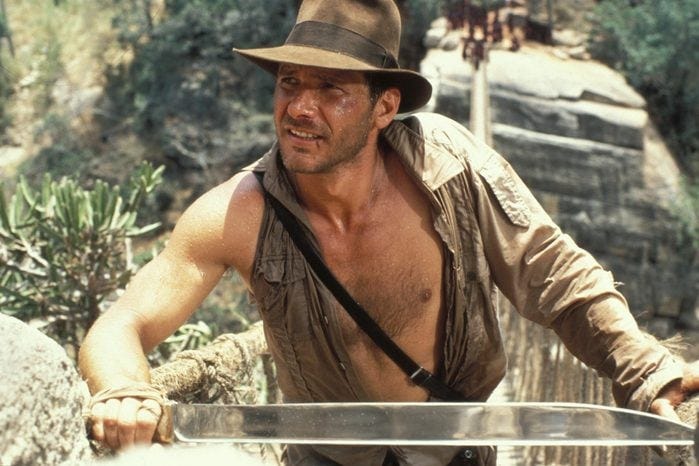 Editorial use only. No book cover usage. Mandatory Credit: Photo by Lucasfilm Ltd/Paramount/Kobal/Shutterstock (5886187c) Harrison Ford Indiana Jones and The Temple Of Doom - 1984 Director: Steven Spielberg Lucasfilm Ltd/Paramount USA Scene Still Action/Adventure Indiana Jones et le temple maudit