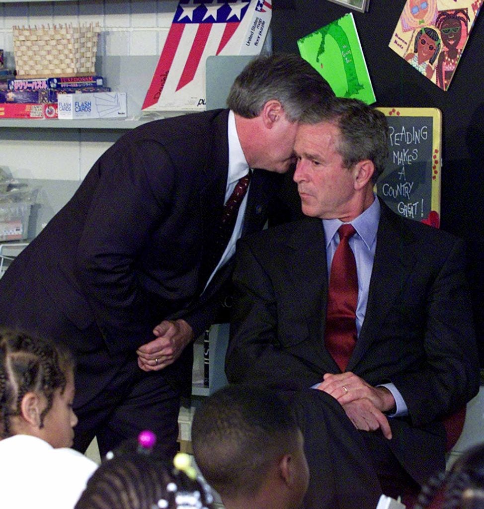 President Bush's Chief of Staff Andy Card whispers into the ear of the President to give him word of the plane crashes into the World Trade Center, during a visit to the Emma E. Booker Elementary School in Sarasota, Fla., Tuesday, Sept. 11, 2001. (AP Photo/Doug Mills)