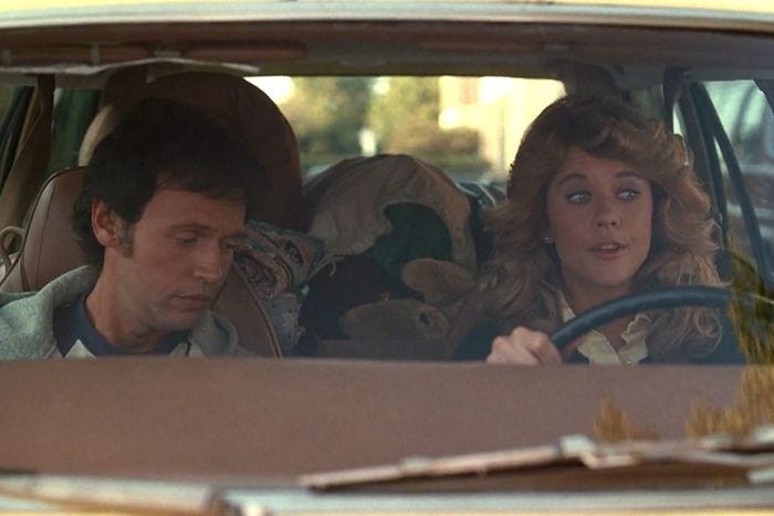 Billy Crystal and Meg Ryan riding together in a car at the beginning of When Harry Met Sally.