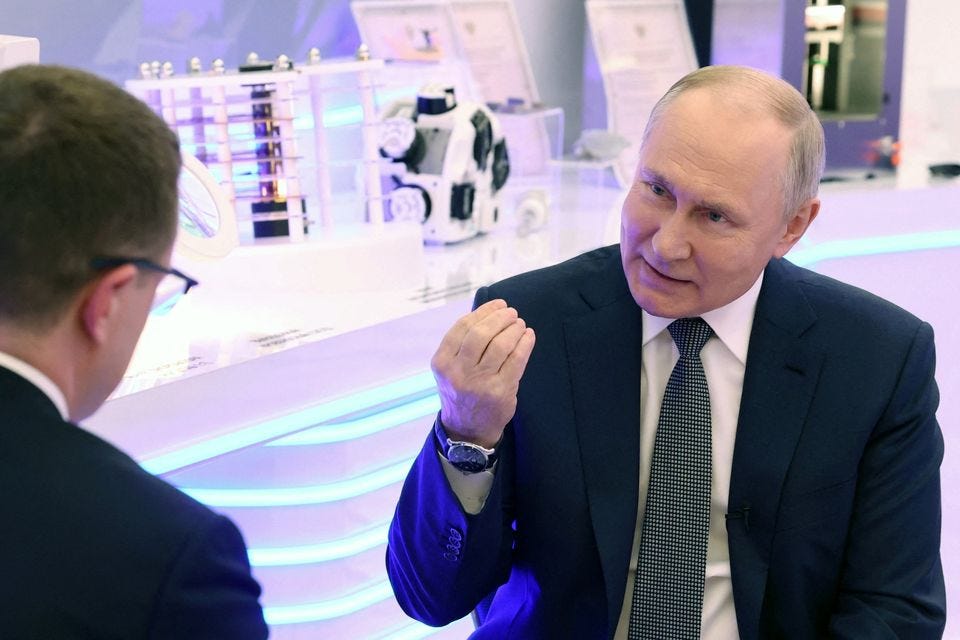 Russian president Vladimir Putin gestures during his interview with journalist Pavel Zarubin. Photo Reuters