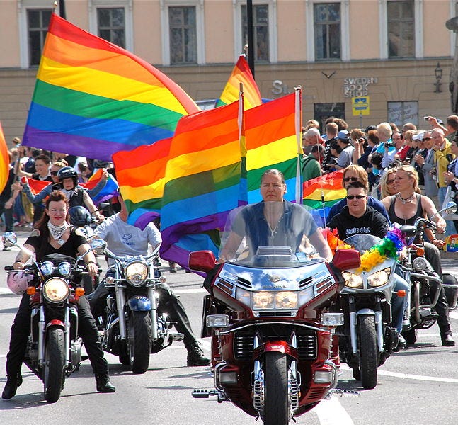 Dykes on Bikes contingent at Stockholm Pride 2010 with motorcycles and pride flags