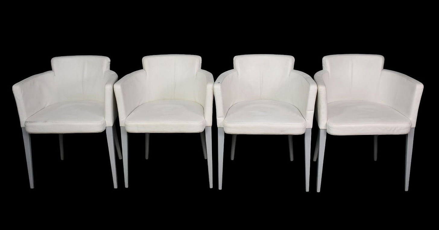 4 white leather Cassina Ariane 364 armchairs, each on 4 tapered metal legs, (some soiling)