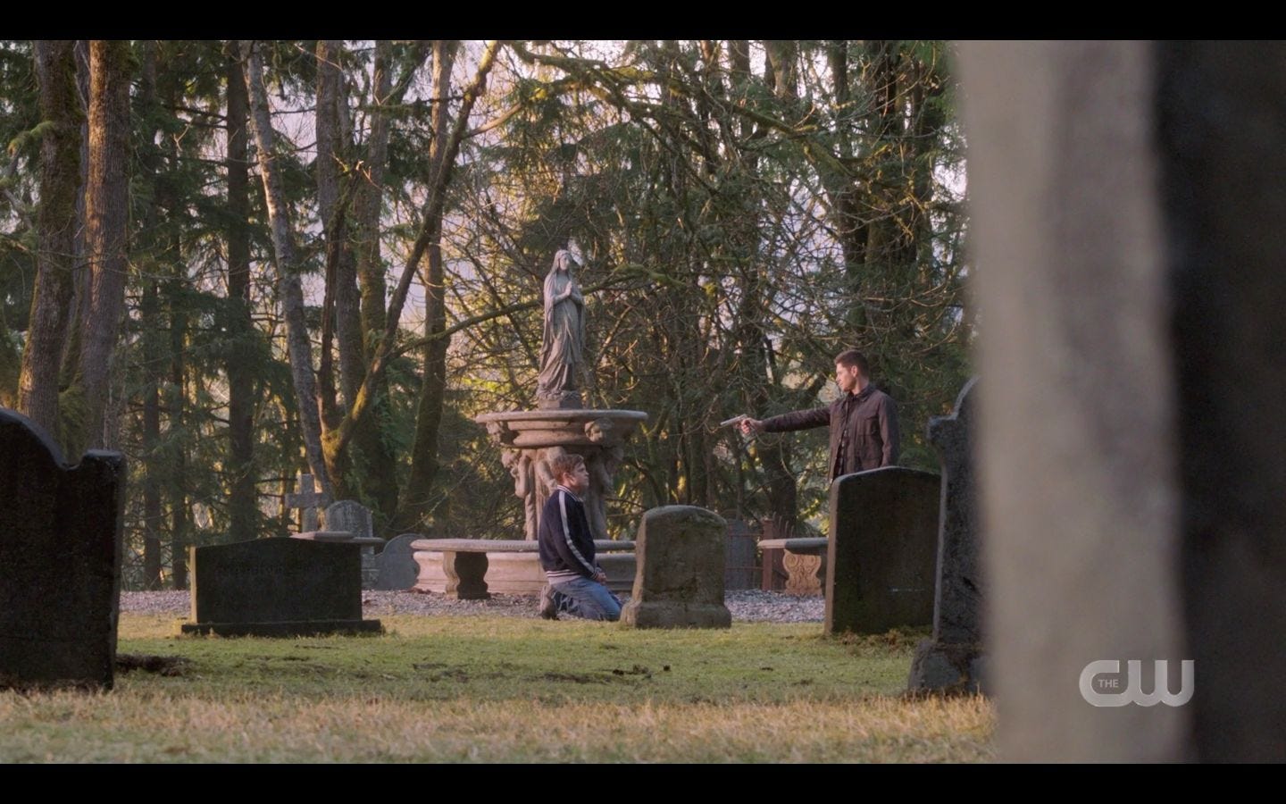 Dean Winchester pointing gun at Castiel in cemetary SPN 14.20