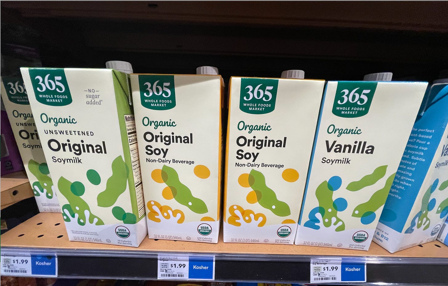 cartons of shelf stable soy milk, one of them says non-dairy beverage