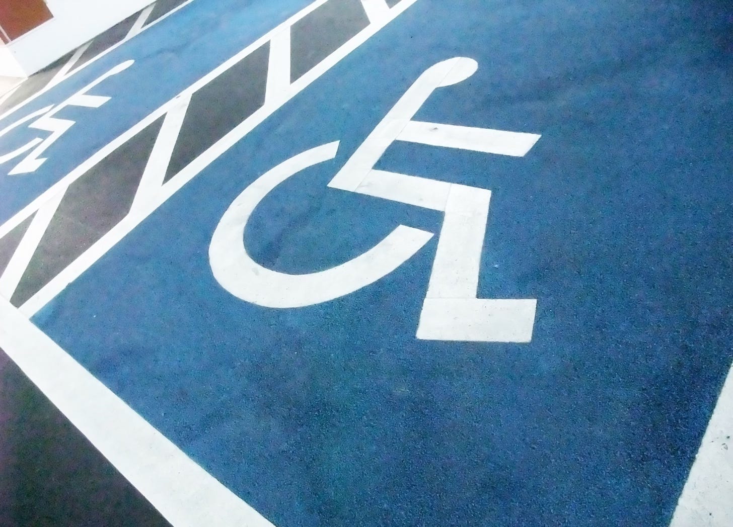 Wheelchair symbols marking accessible parking spaces