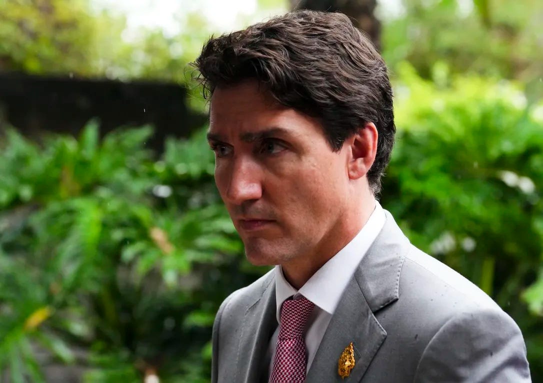 Prime Minister Justin Trudeau makes his way to his vehicle as he leaves the G20 Leaders Summit in Bali, Indonesia on Nov. 16, 2022.