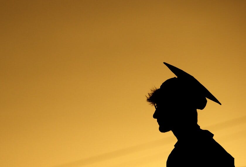 Coleton McLemore is silhouetted against the sky during the Commencement Exercises for the Class of 2020 at Lakeview-Fort Oglethorpe High School's Tommy Cash Stadium on July 31, 2020 in Fort Oglethorpe, Ga.