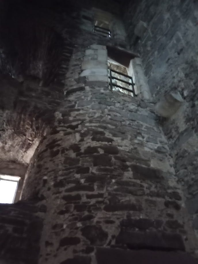 Spiral staircase tower enclosed within stone tower