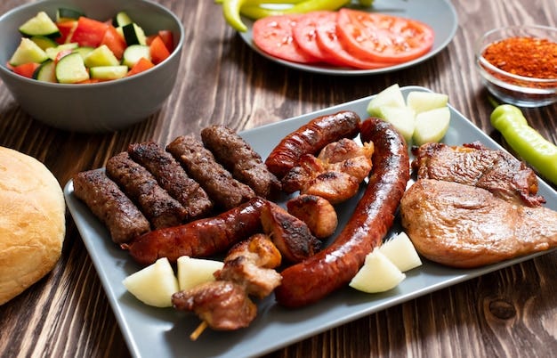 Premium Photo | Traditional serbian and balkan grilled meat called mesano  meso. balkan barbeque (rostilj) served with serbian salad, hot peppers,  bread, tomato, onions, and paprika powder. wooden background. close-up