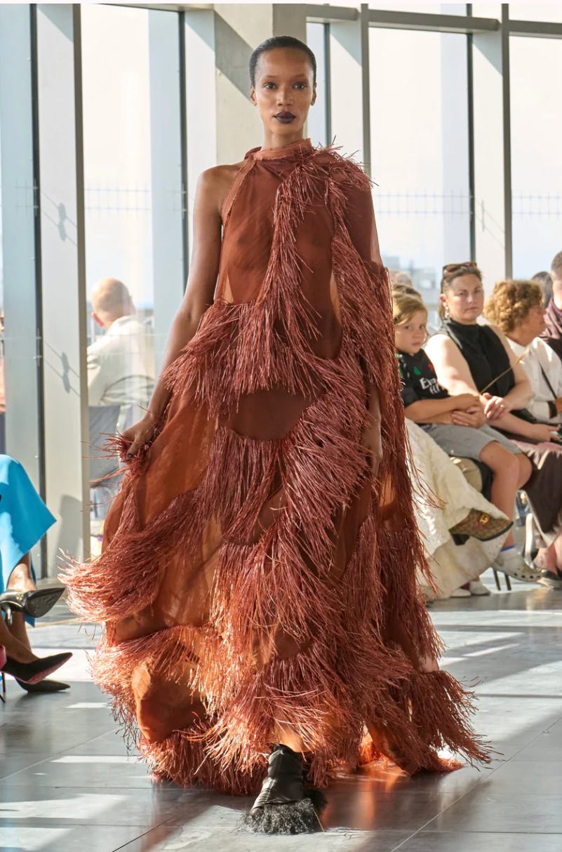 Model: Nadja Giramata wearing feathers to mirror wheat. Image Credit: Roksanda