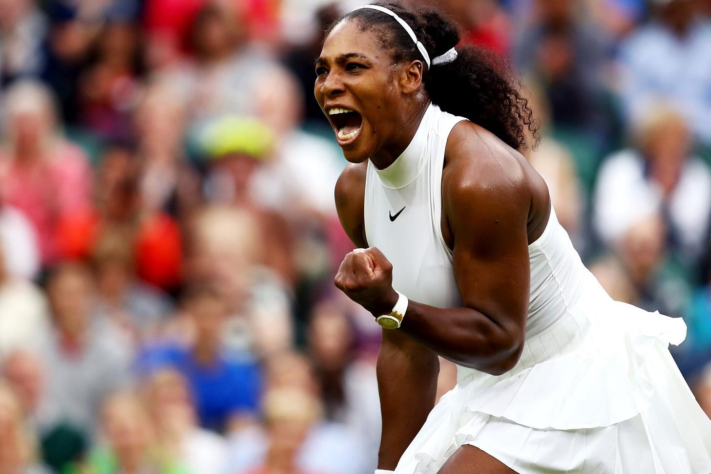 Serena Williams Pumps victoriously pumps her fist after serving at the Australian Open 2024