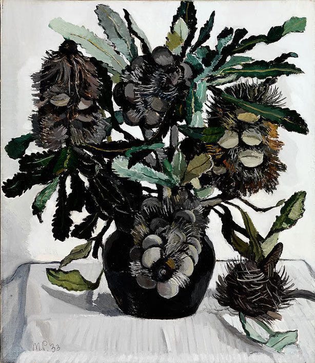 A black vase contains stems of Australian banksia pods, with dark stiff lobes and bristles, and thin green serrated leaves. The pods and leaves appear to writhe with dark shadows and starkly illuminated surfaces.