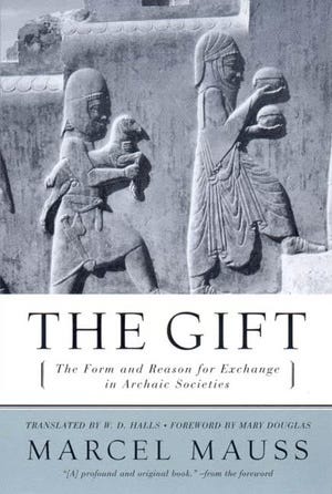 Cover of the book The Gift: The Form and Reason for Exchange in Archaic Societies by Marcel Mauss. Above the title and author is a photograph of an ancient bas-relief, perhaps Assyrian, showing to people climbing stairs while carrying offerings of bread and a lamb.