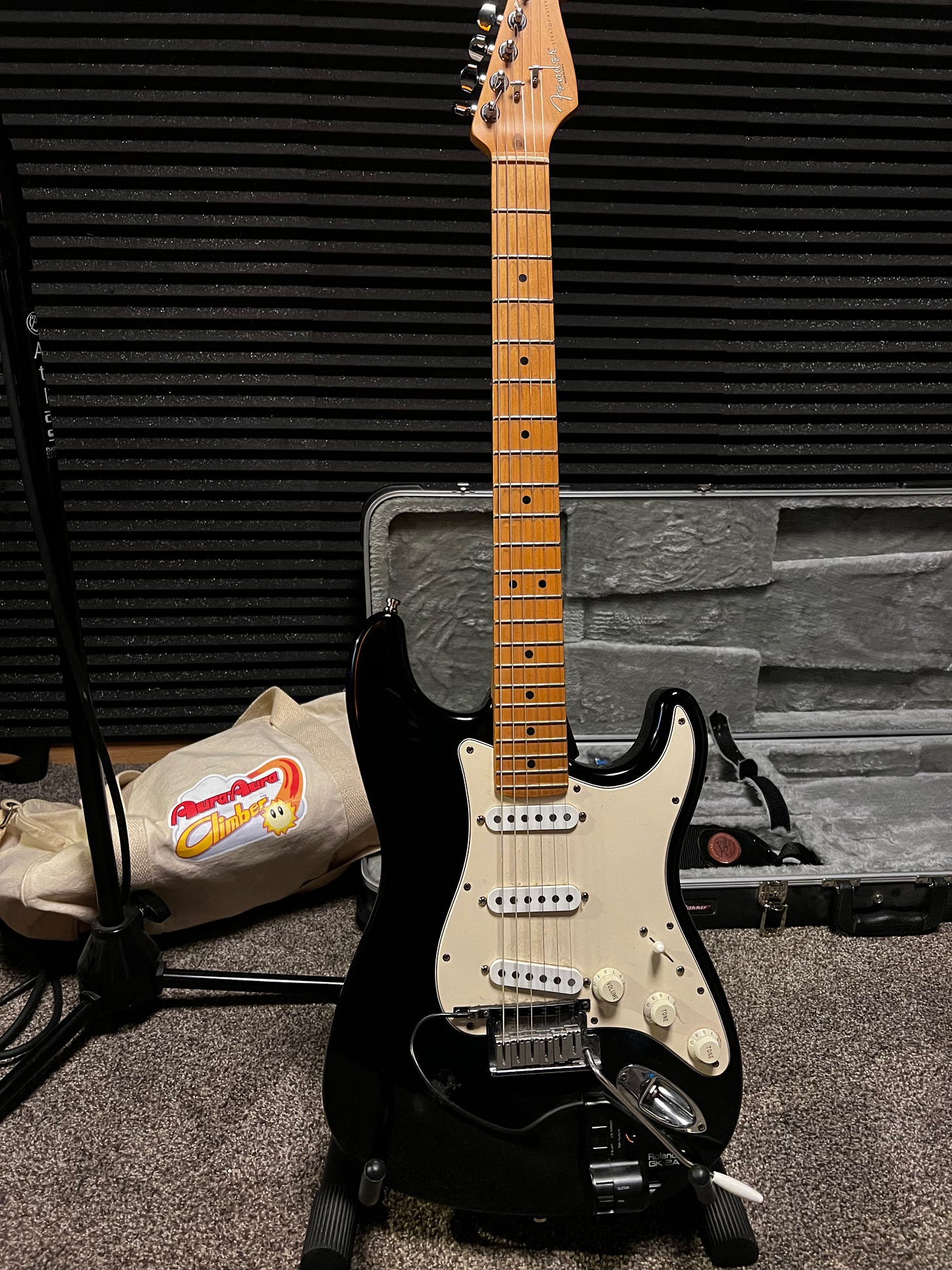 The guitar Lawrence used for Mewtwo's theme from Pokémon Puzzle League. Also featured is a swag bag from another game Lawrence worked on called Aura Aura Climber