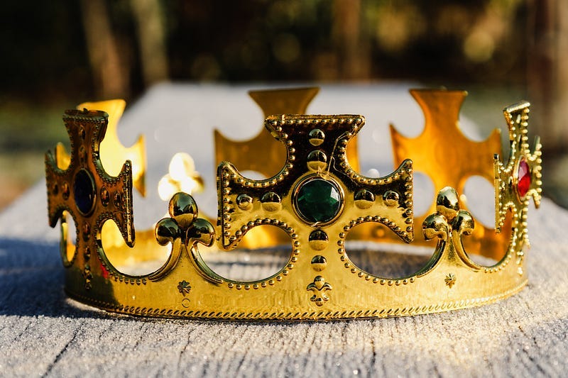 A gold crown lying on the floor