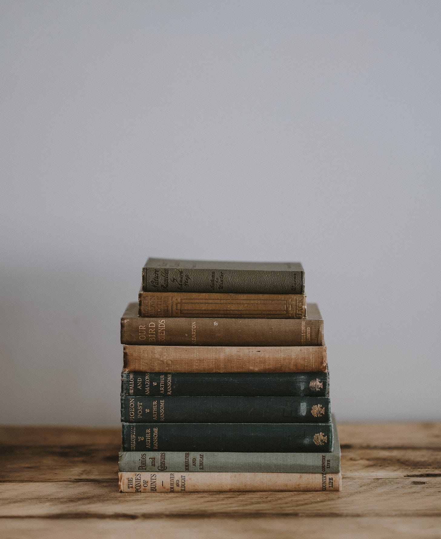 A stack of old books about birds.