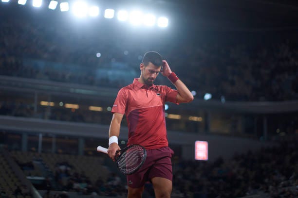 Novak Djokovic of Serbia looks on during his match against Lorenzo Musetti of Italy in the Men's Singles third round match on Day Seven of the 2024...