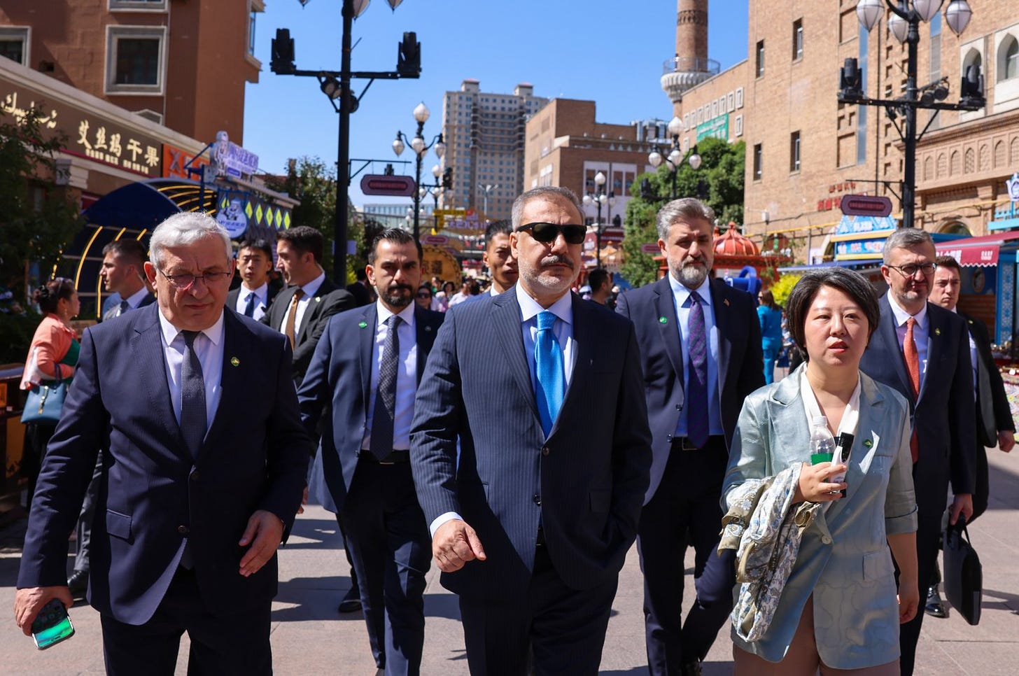 Foreign Minister Hakan Fidan (C) tours the International Grand Bazaar in Urumqi, the capital of Xinjiang province, China, June 5, 2024. (AA Photo)