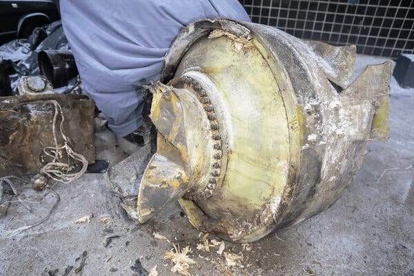 A conical piece of metal broken on both ends left over from a North Korean missile used by Russia to attack Ukraine.