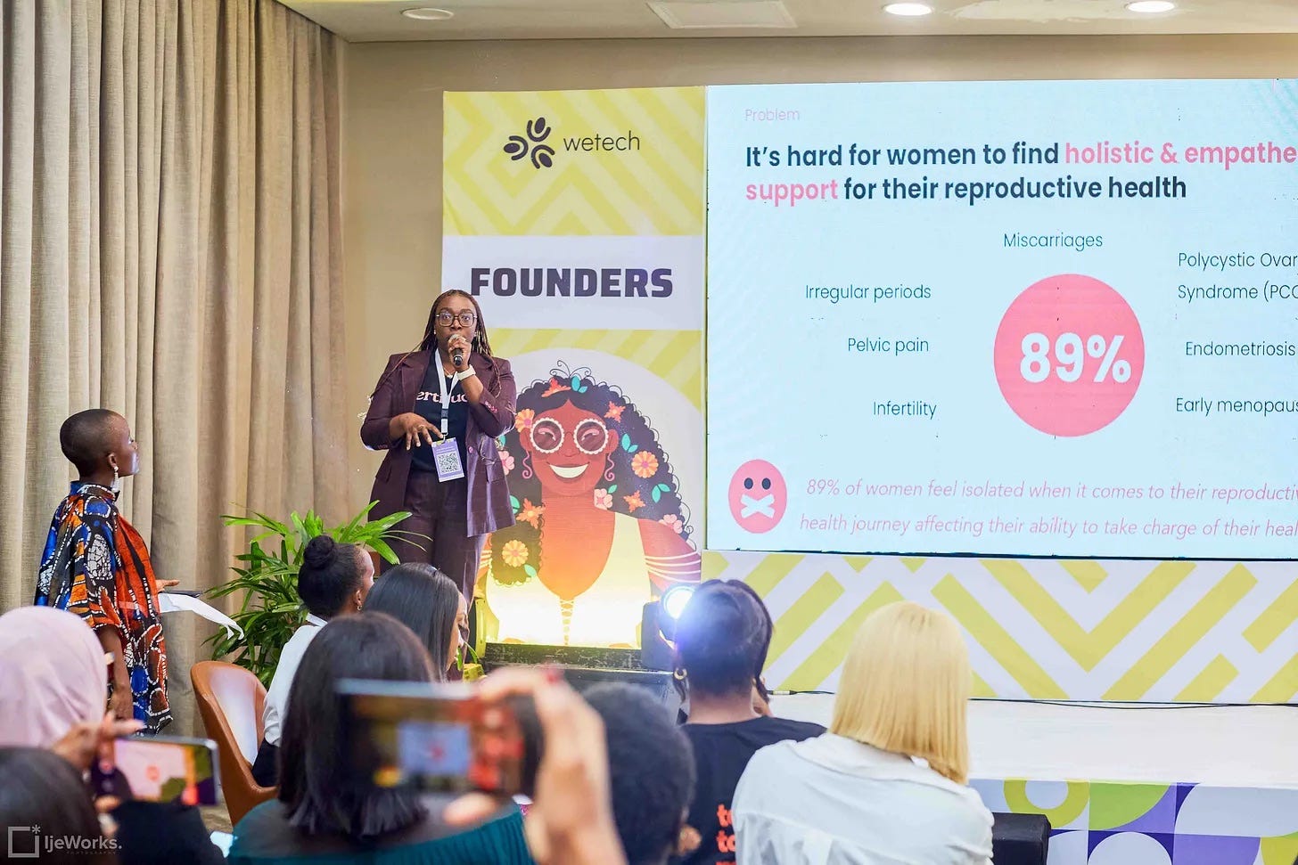 Photo of Kieva pitching Fertitude at WeTech 2023 by IjeWorks.