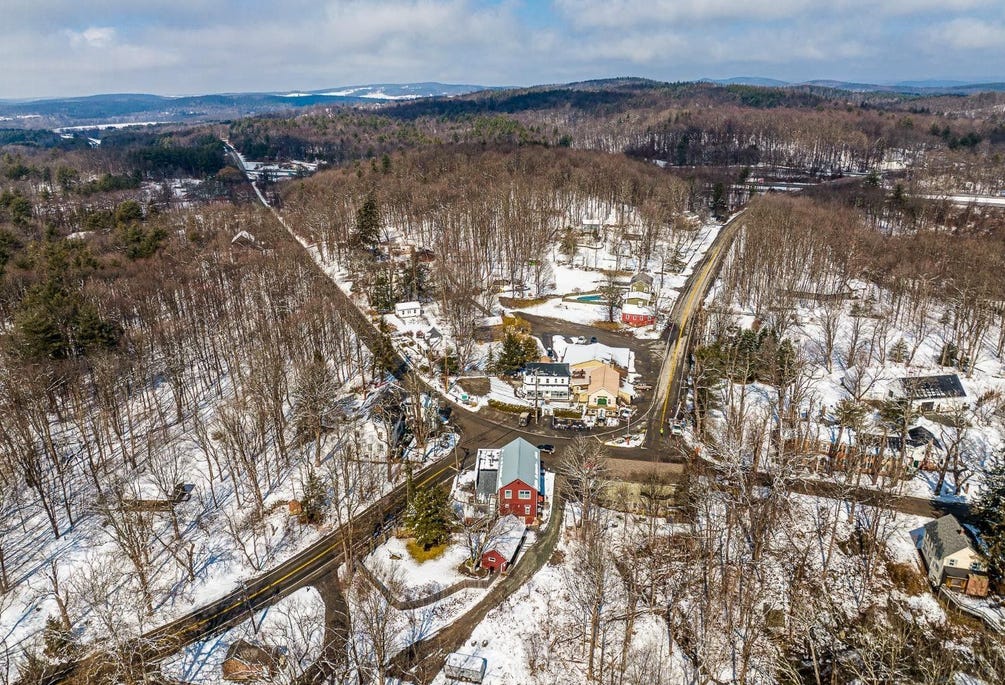 Snowy aerial view of Old Chatham, NY with the Catskill Mountains in view, 40 miles away.