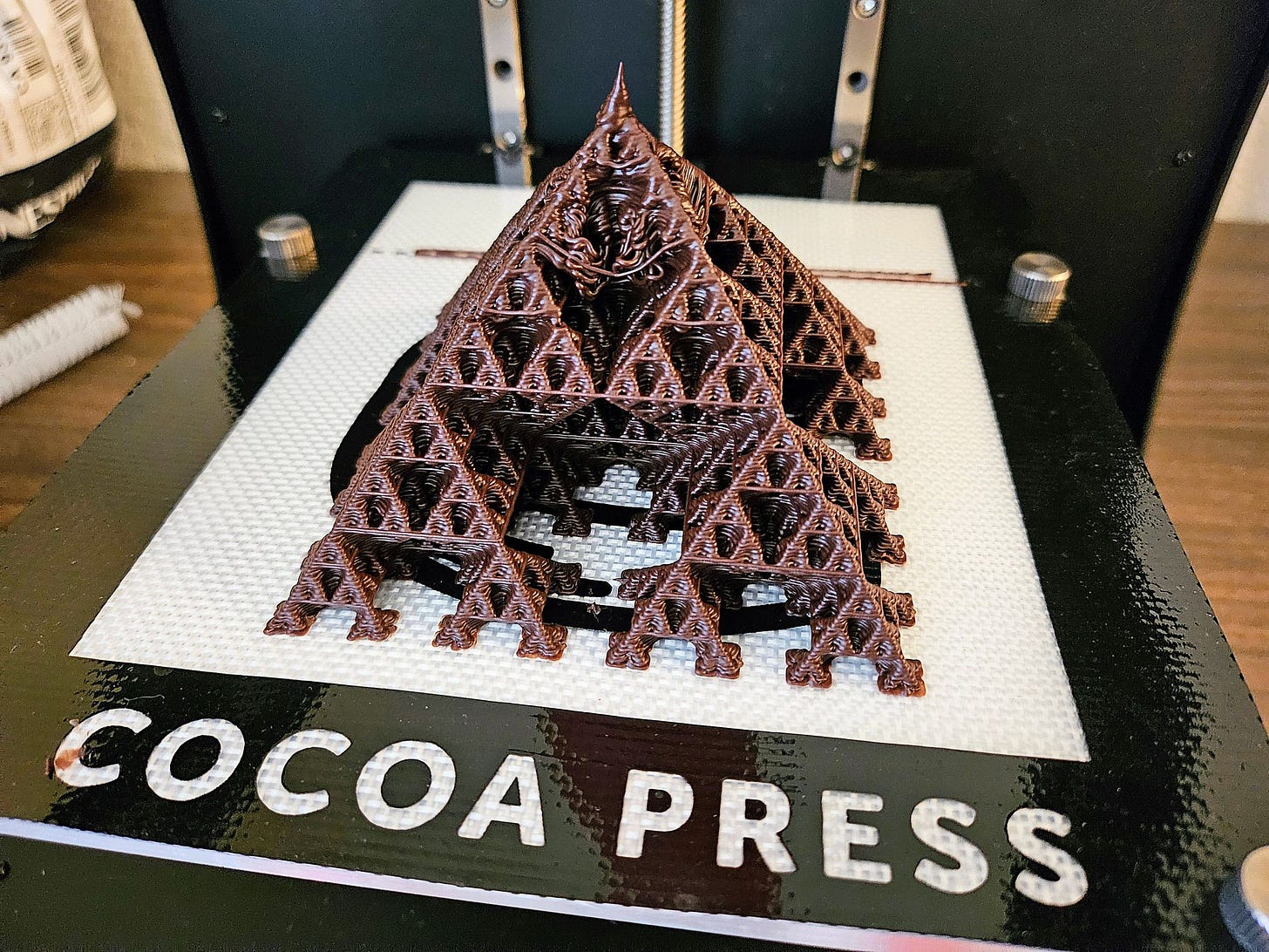The chocolate Sierpinski pyramid nicely breaks into four smaller pyramids for serving — and one central octahedron for your family to fight over.