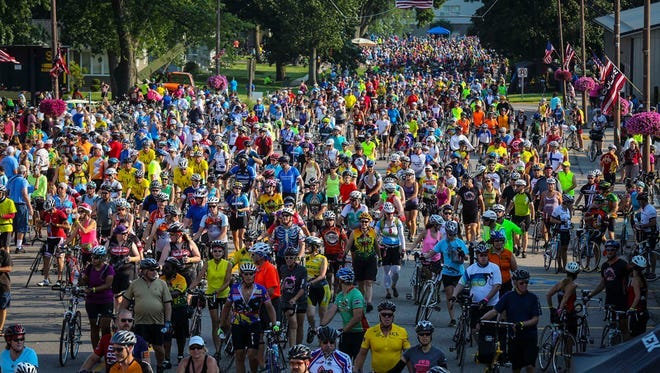 Riders fill the streets in Hull during RAGBRAI 2014 from Rock Valley to Okoboji Sunday July 20, 2014. Riders fill the streets in Hull during RAGBRAI 2014 from Rock Valley to Okoboji Sunday July 20, 2014.
