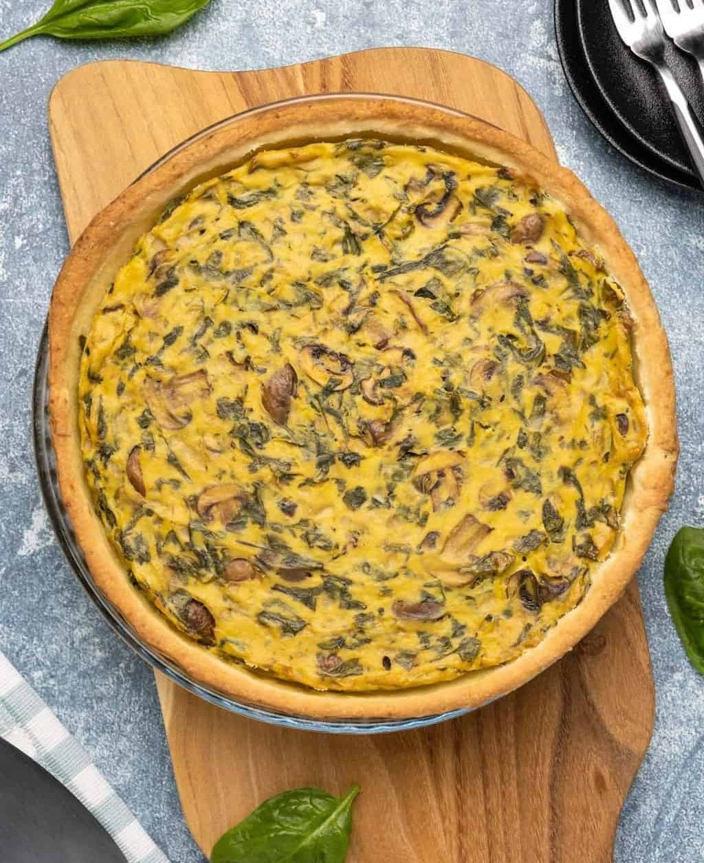 Vegan quiche in a glass pie dish. 