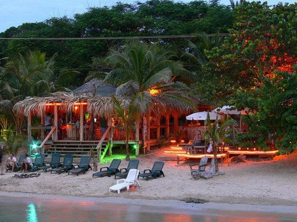 Sundowners Beach bar at sunset - one of the best bars in Roatan