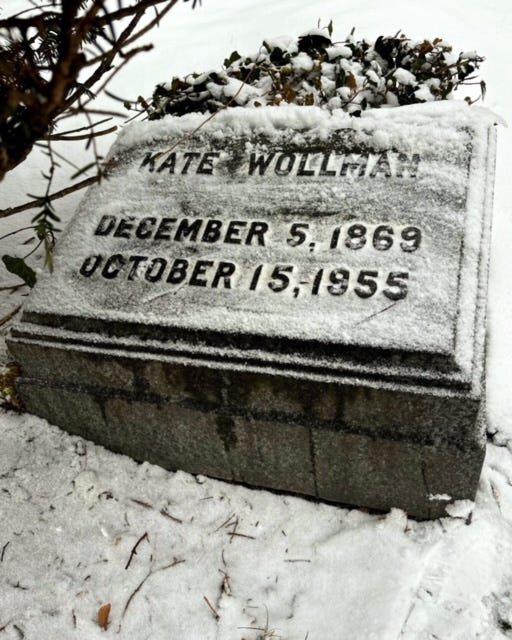 Kate Wollman's headstone with the snow brushed aside. There is no epitaph.