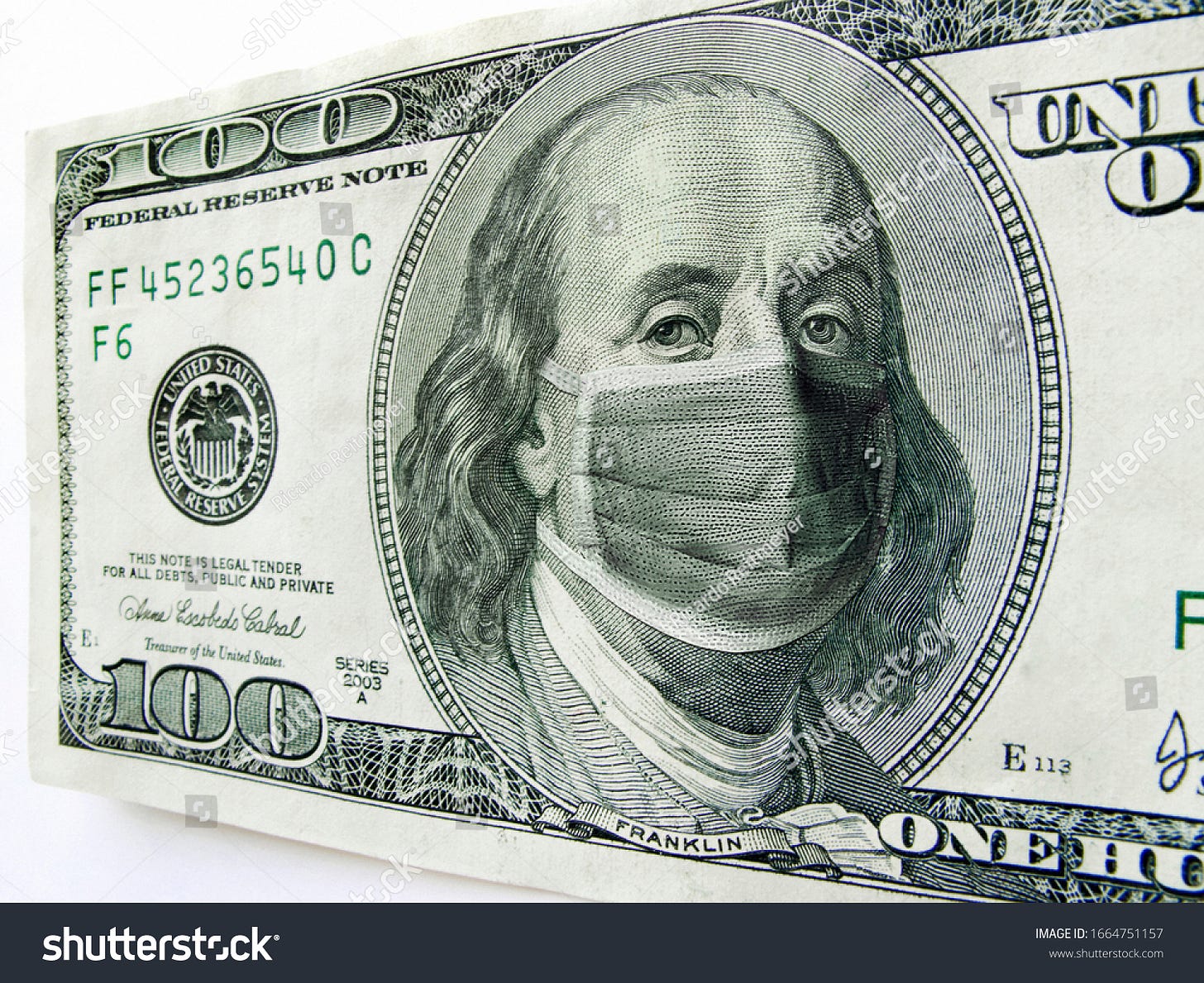 This photo illustration of Ben Franklin wearing a healthcare surgical mask on a one hundred dollar bill illustrates the many problems of the   Coronavirus, including medical, travel  and economic. 
