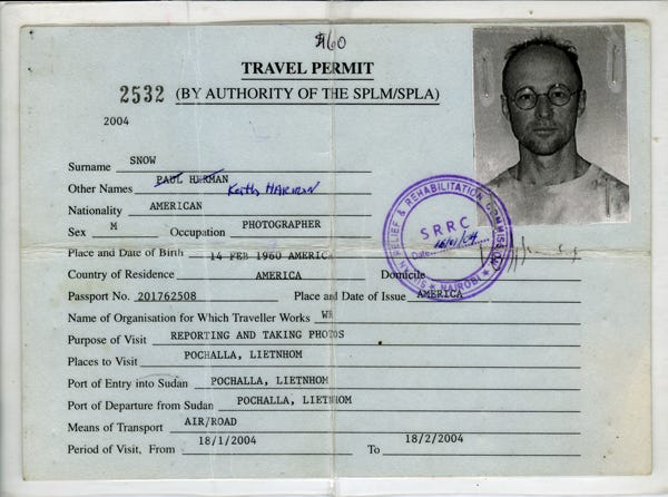 A passport with a photo of a person

Description automatically generated