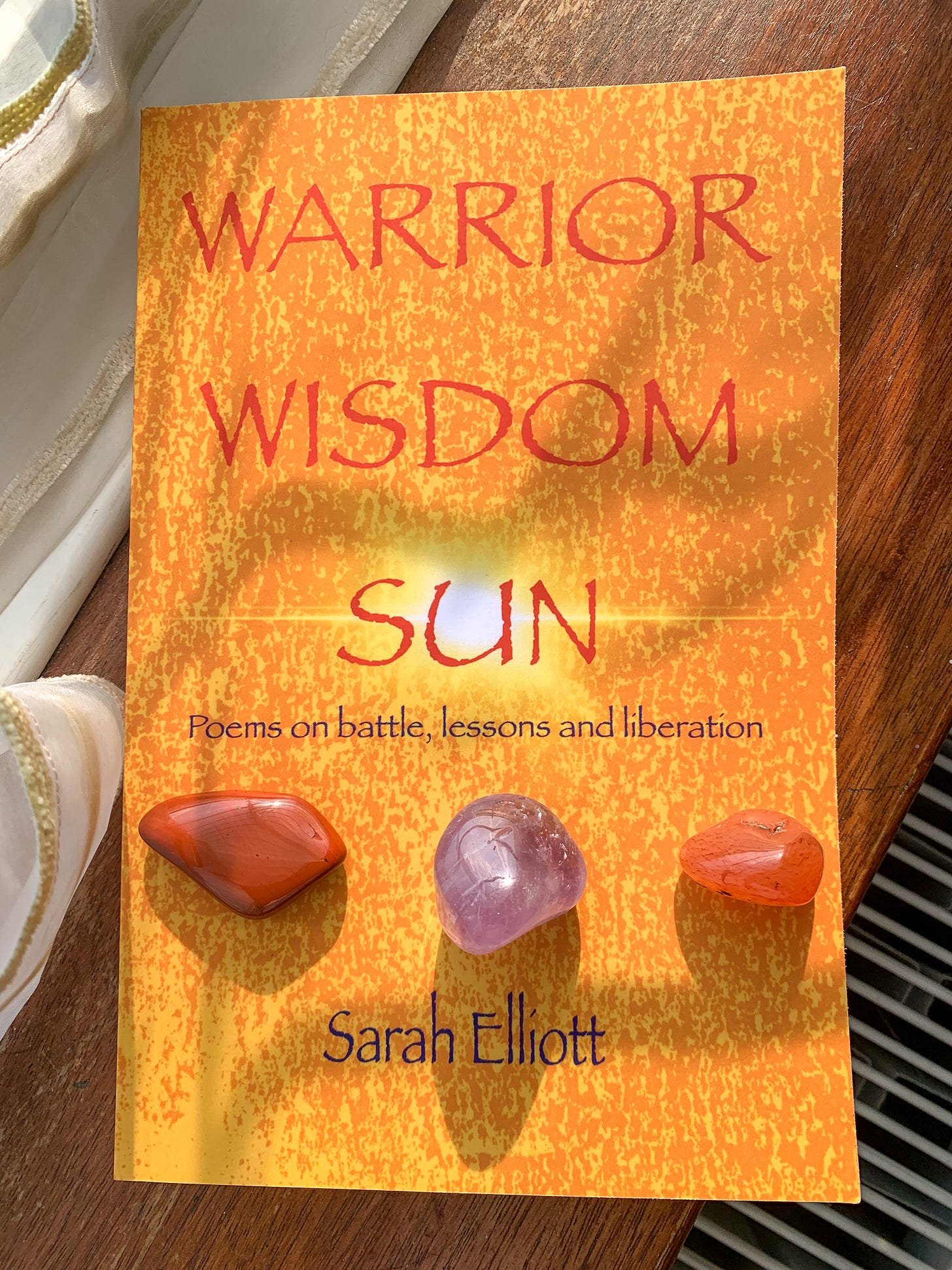 Book in sunlight on shelf - Warrior Wisdom Sun