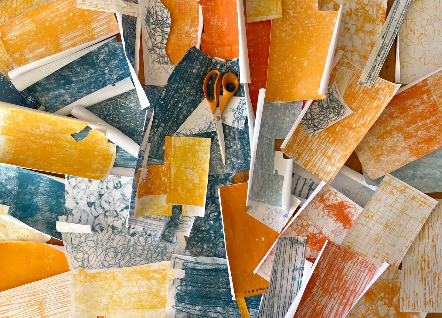 orange and blue textured collage papers by Nanette Regan