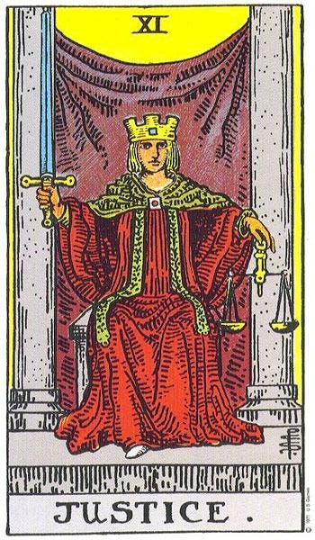 The Justice card from the famous Rider-Waite-Smith-Coleman Tarot deck depicts a blonde, seated figure between two stone pillars. The figure holds a sword in their right hand, and a pair of golden scales in their left. They wear a crown and a red robe and gaze straight ahead.
