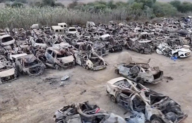 Destroyed cars in a field