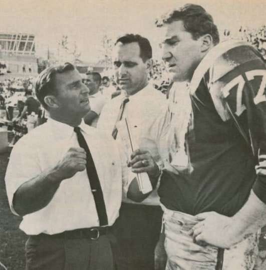 Kansas City Chiefs sideline in the late 1960. Head coach Hank Stram and the outstanding offensive tackle Jim Tyrer (#77). Tyrer was an 8 time All AFL, and 2 time NFL All Pro 