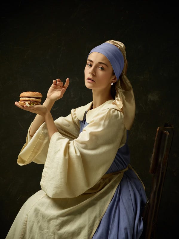 Vermeer's Girl with a Pearl Earring is thought to show an international woman due to her dress and turban. This poor girl is stuck holding up a shitty burger. She'd rather be writing and wandering in Iceland.