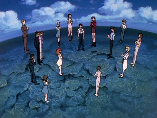 The anime’s cast is standing on a blue planet, standing on what looks like coral structures under bright blue waters. Shinji is at the middle, surrounded by his friends and family congratulating him.