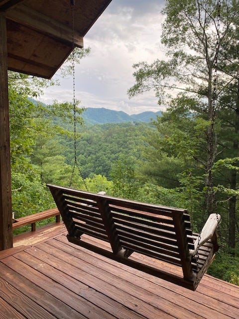 mountain view from a swing on a porch
