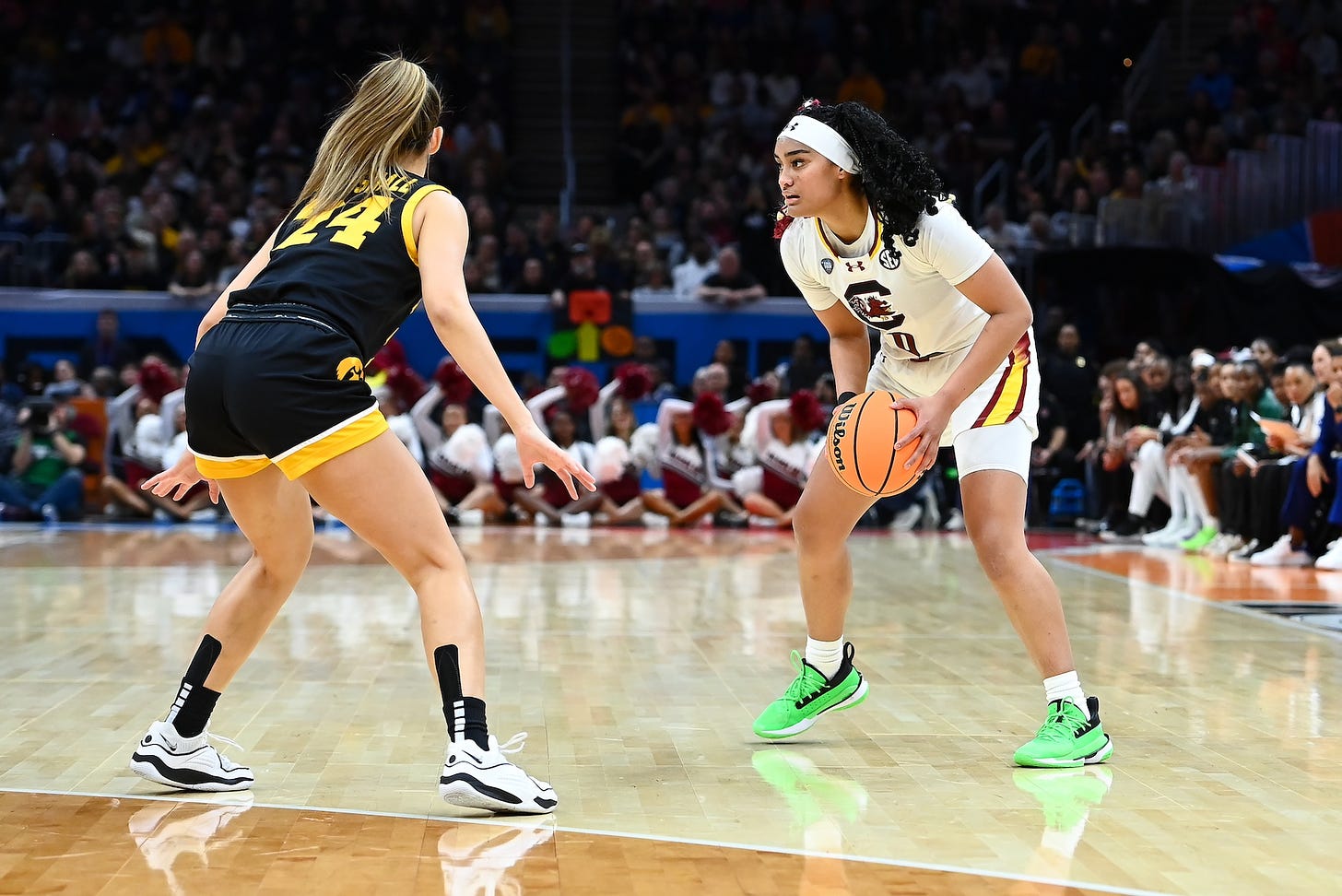 Te-Hina Paopao, right, of South Carolina is guarded by an Iowa defender during the women’s national championship game on Sunday in Cleveland. Paopao hit three 3-pointers to help lead the Gamecocks to the title and an undefeated season. Photo credit South Carolina Athletics