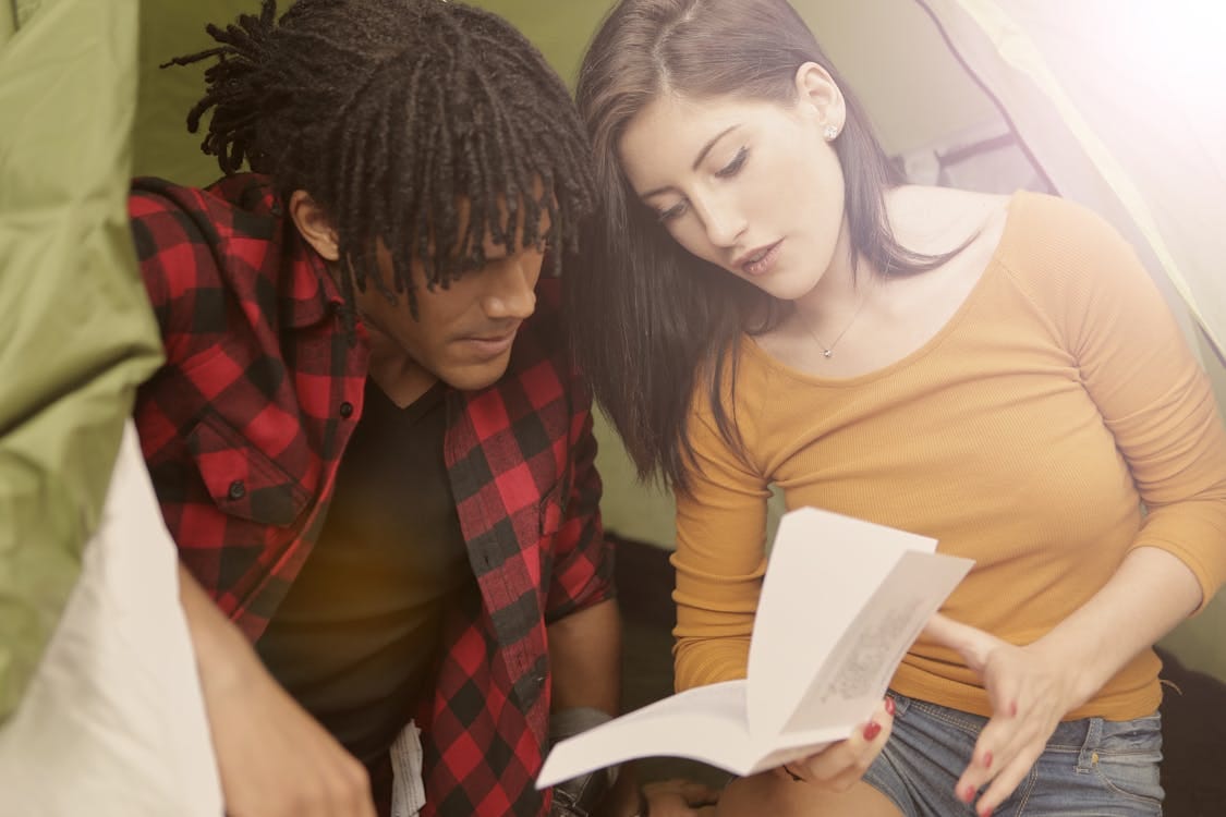 Free Couple Reading a Book Stock Photo