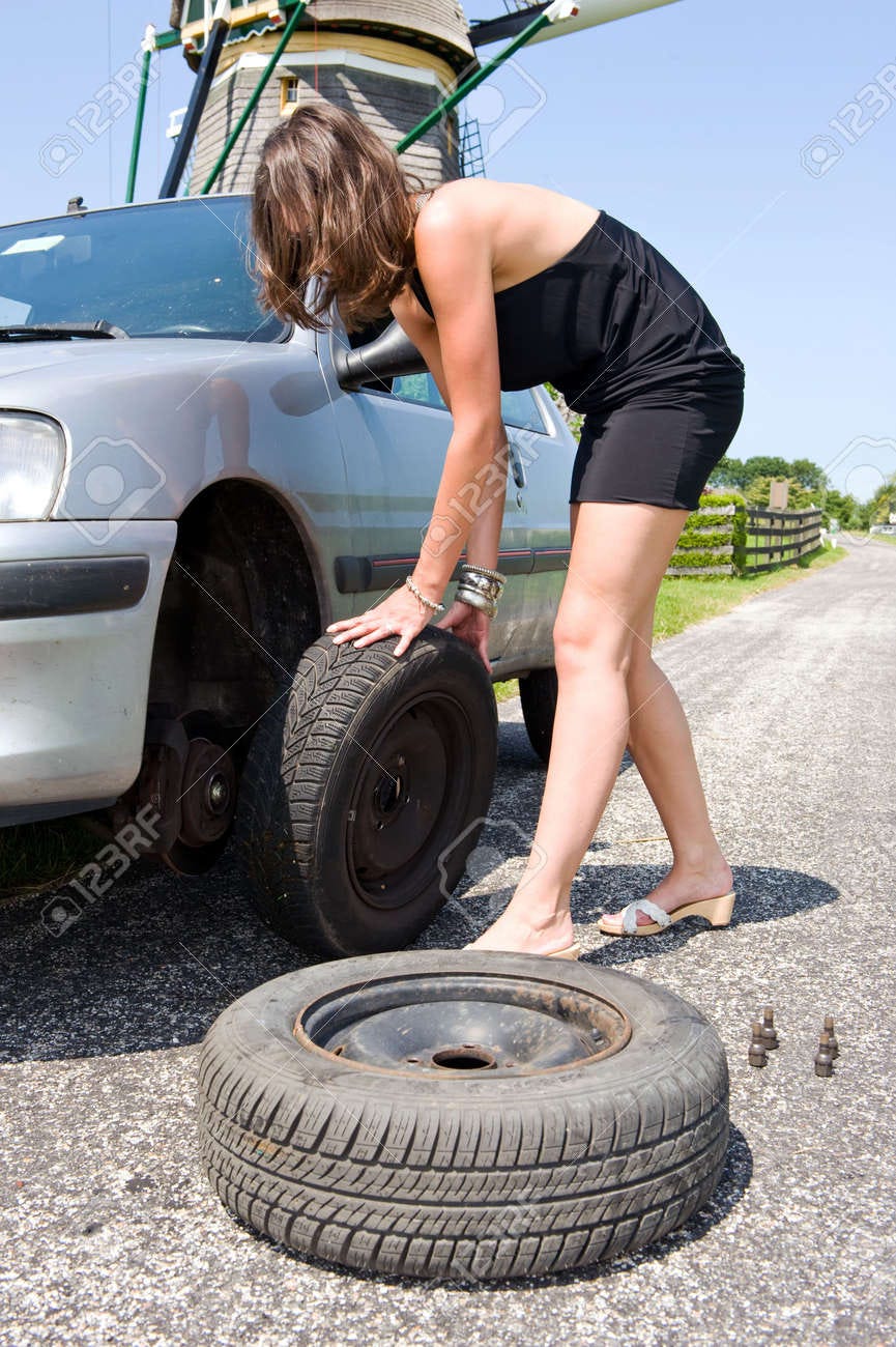 Image result for woman changing tire Image result for woman changing tire