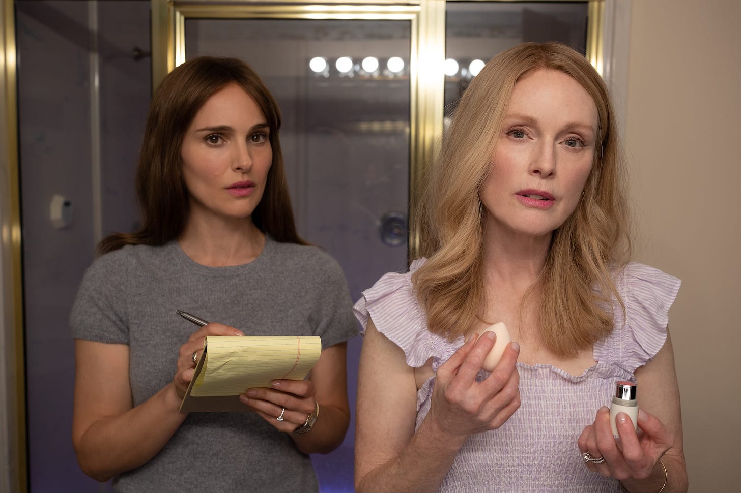 Natalie Portman as Elizabeth and Julianne Moore as Gracie in May December