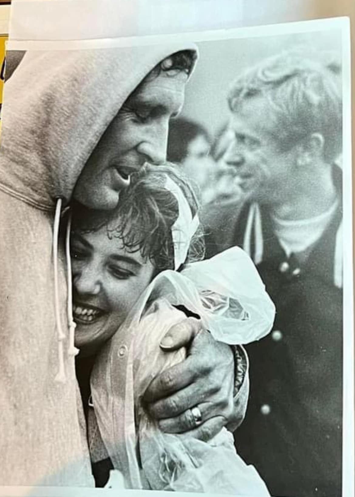 May be a black-and-white image of 2 people and child