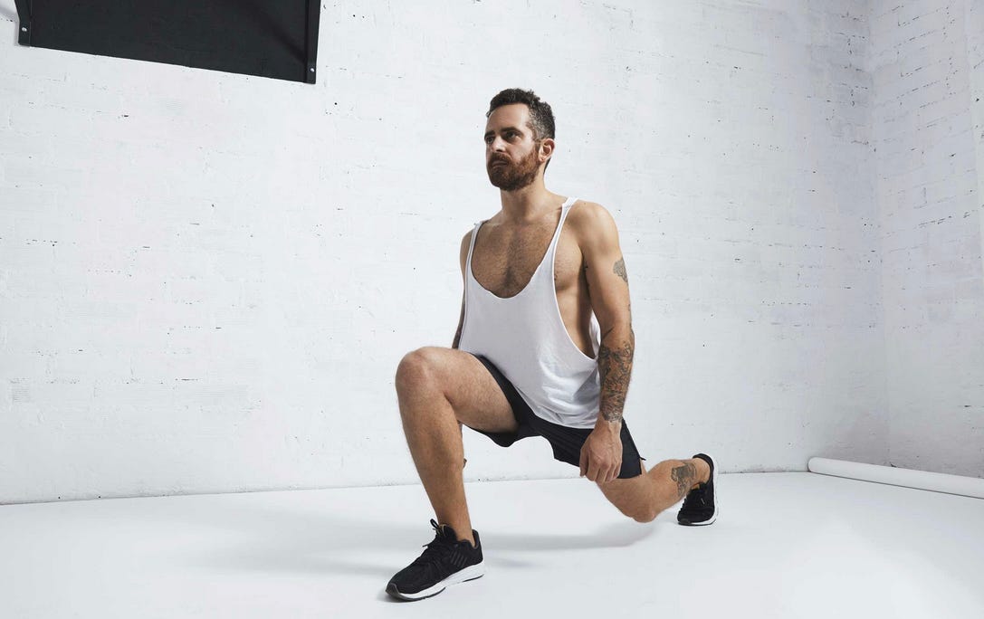 Man performing walking lunge