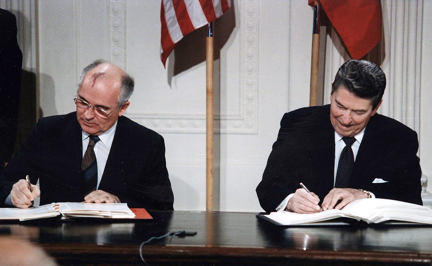 Gorbachev and Reagan sign the INF Treaty.