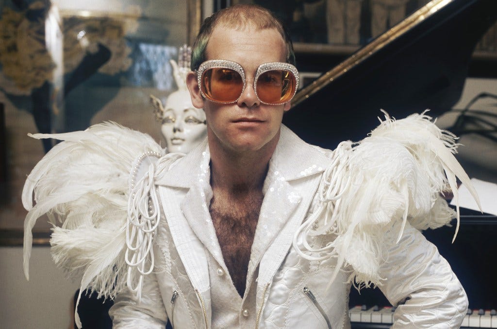 Elton John Style Evolution: Fashion Photos From 1970s to Now