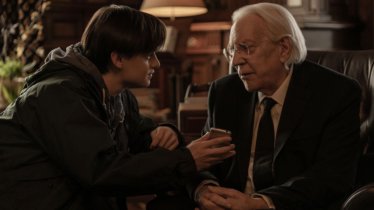 Jaeden Martell as Craig and Donald Sutherland as Mr. Harrigan in Mr. Harrigan’s Phone.