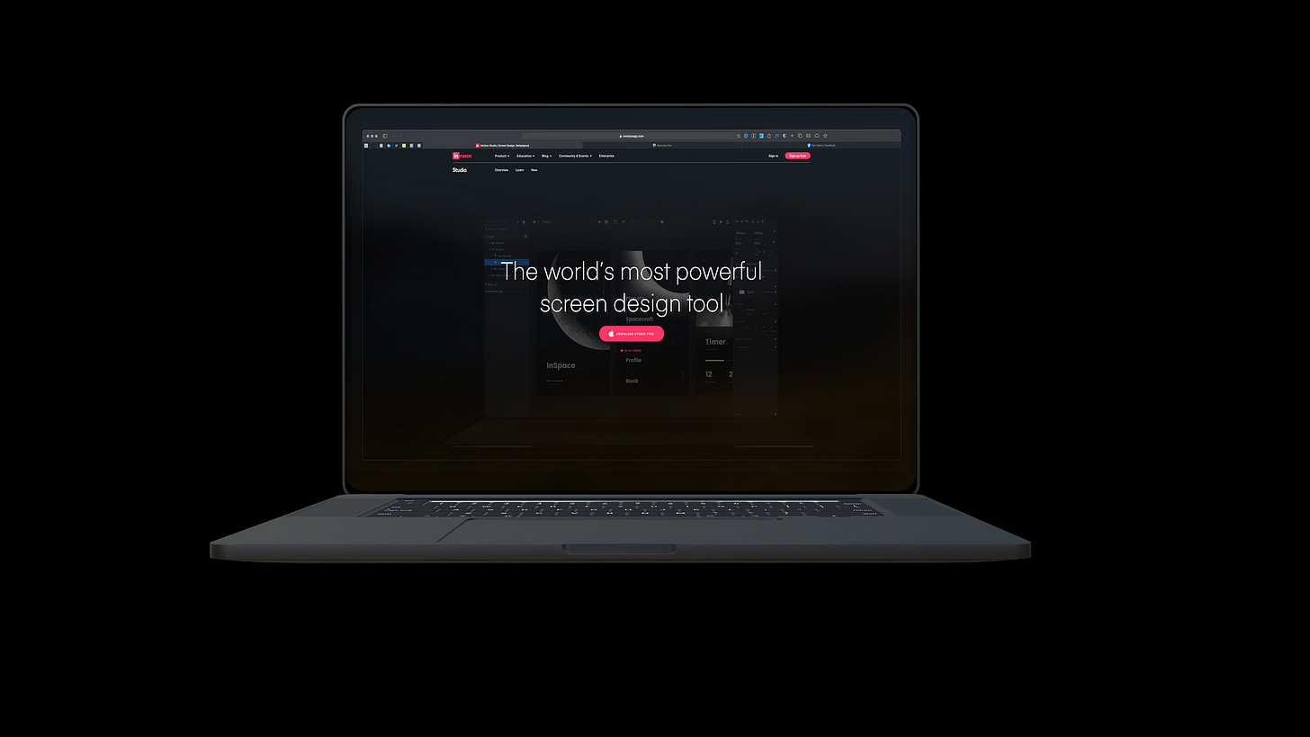 A laptop with the Invision Studio splash screen in a web browser.